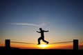 Slackliner in sunset Royalty Free Stock Photo