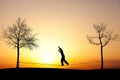 Slackliner in sunset Royalty Free Stock Photo