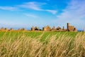 Slains Castle panorama in sunny day and blue sky zoom out Royalty Free Stock Photo
