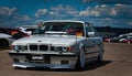 Slammed white BMW 5 series at car show Royalty Free Stock Photo