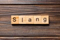Slang word written on wood block. slang text on table, concept Royalty Free Stock Photo