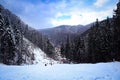 Slanic Moldova, Bacau, Romania - February 21, 2021: Lots of people waiting for the chairlift to the Nemira ski slope in Slanic