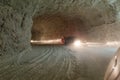 Cars driving into a tunnel from Slanic Prahova salt pan