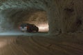 Cars driving into a tunnel from Slanic Prahova salt pan