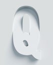 Slanted 3d font engraved and extruded from the surface, letter Q