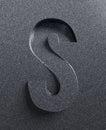 Slanted 3d font engraved and extruded from the surface, letter S