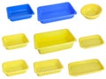 Slanted view different types of yellow trays isolated on white background - black plastic trays - trays food - rectanguler trays Royalty Free Stock Photo