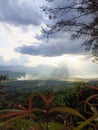 a slanted view of the sun shining through the clouds