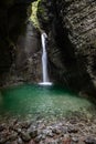 Slap Kozjak waterfall emerging into cave pool near Kobarid, Slovenia Royalty Free Stock Photo