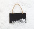 Slate chalkboard in snow Royalty Free Stock Photo