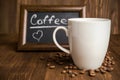 Slate with coffee beans and a cup