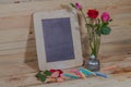 slate, pastel and roses on the pinewood table Royalty Free Stock Photo