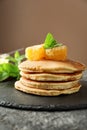 Slate plate with tasty homemade pancakes on table Royalty Free Stock Photo