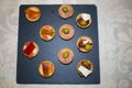 Slate plate with various canapes of different flavours and textures Royalty Free Stock Photo