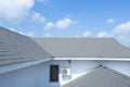 Slate roof against blue sky, Gray tile roof of construction house with blue sky and cloud Royalty Free Stock Photo