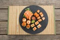 Slate tray of assorted sushi kept on mat Royalty Free Stock Photo