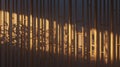 Slatted bamboo room divider casting soft shadows in a minimalist zen space Royalty Free Stock Photo