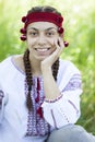 Slav girl at green meadow. Royalty Free Stock Photo