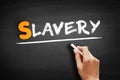 Slavery text on blackboard Royalty Free Stock Photo