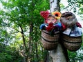 Slavic bast shoes amulets hang on a tree in the forest
