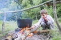 Slavic child in national clothes near the fire. Royalty Free Stock Photo