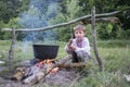 Slavic child in national clothes near the fire. Royalty Free Stock Photo