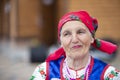 Slavic elderly woman in national ethnic clothes