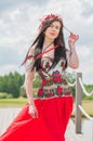 Slavic lady in traditional dress, in wreath on a head