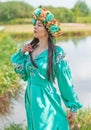 Slavic lady in traditional dress, in wreath on a head