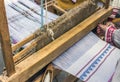 Slavic linen on loom, woman hand weaving.