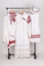 Slavic traditional clothing: women\'s and men\'s shirts, hat and apron Royalty Free Stock Photo