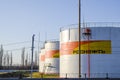 Reservoirs with fuel at the oil depot of Rosneft. Tanks in the light of the setting sun.