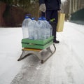 Sled loaded with plastic bottles with water Royalty Free Stock Photo