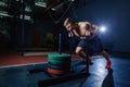 Sled push man pushing weights workout exercise at gym. Cross fit style