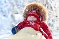 Sled and snow fun for kids. Baby sledding in winter park. Royalty Free Stock Photo