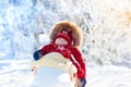 Sled and snow fun for kids. Baby sledding in winter park. Royalty Free Stock Photo