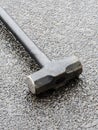 sledge hammer on concrete surface