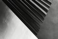 A sleek abstract background with charcoal gray, black, and silver, featuring geometric lines and
