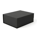 A sleek black box with a matte finish standing upright against a white background Royalty Free Stock Photo