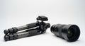 Professional camera tripod with large wide-angle lens on white background Royalty Free Stock Photo