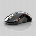 Sleek black computer mouse featuring streamlined design and ergonomic shape placed on a reflective surface Royalty Free Stock Photo