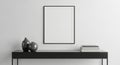 Minimalist console table with vases and books below a blank frame Royalty Free Stock Photo
