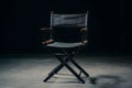 Sleek black directors chair with folding frame and armrests in professional setting Royalty Free Stock Photo