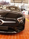 Sleek black Mercedes-Benz E-class vehicle on display in a contemporary showroom