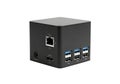 Compact black mini computer hub featuring USB ports, HDMI, and Ethernet for modern connectivity solutions Royalty Free Stock Photo