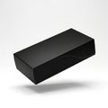 A sleek, black rectangular box with smooth surfaces and sharp edges, floating against a plain white Royalty Free Stock Photo