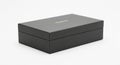 Sleek black rectangular gift box with gold embossed logo on a white background image photo Royalty Free Stock Photo