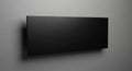 Sleek Black Rectangular Mounted on a Textured Gray Wall with Subtle Lighting (715) living Royalty Free Stock Photo