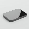 A sleek, black, rectangular object with rounded corners, possibly a smartphone or digital Royalty Free Stock Photo