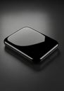 A sleek, black, rectangular object with rounded edges, possibly a hard drive or a tech Royalty Free Stock Photo